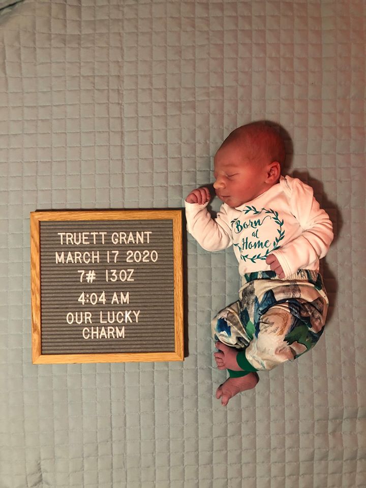 Hypno-mom Amanda Baby laying next to sign with name, date and weight