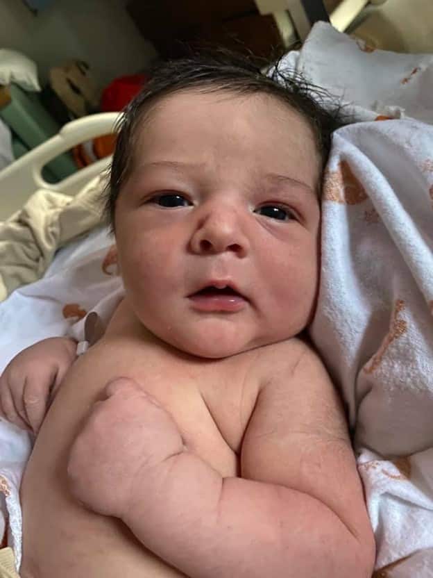 10 lb newborn baby looking into camera