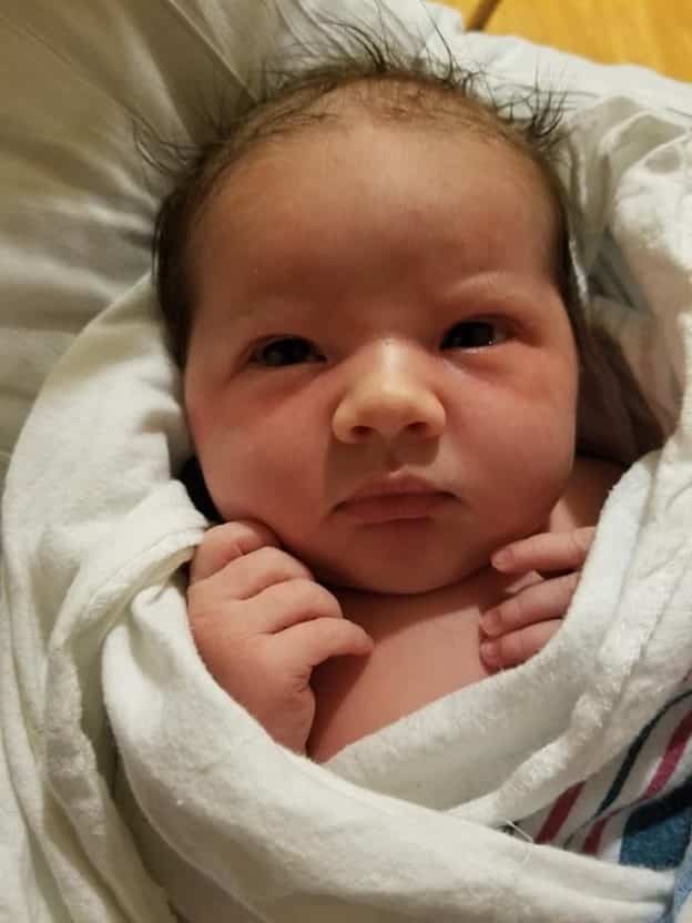 Swaddled newborn baby