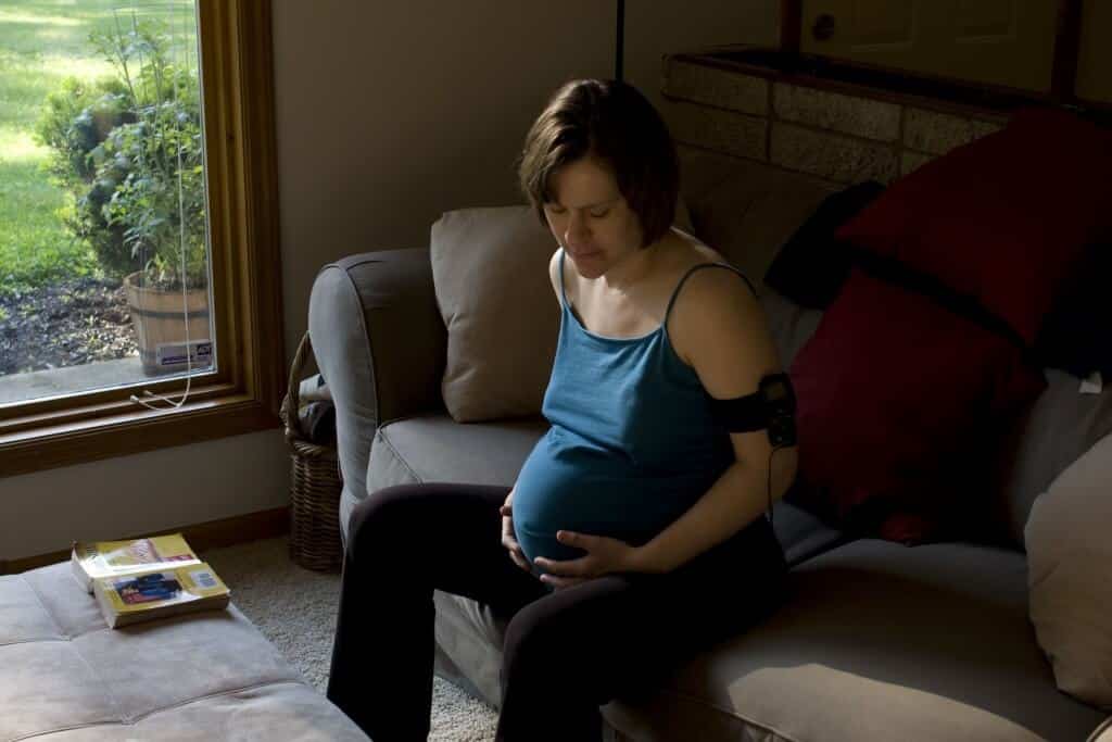 Cassandra Vore Walking sitting on sofa