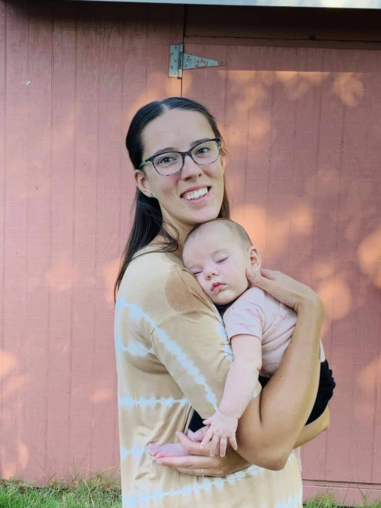 New Hypnobabies mom standing outside holding her baby