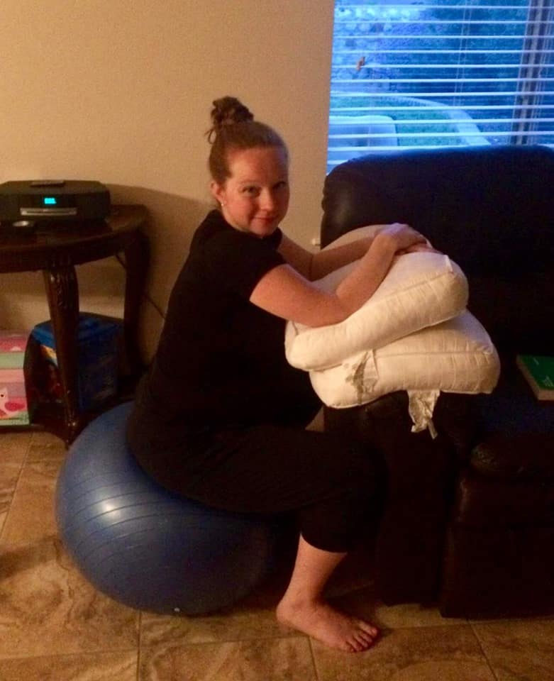 Hypno-mom Julia sitting on birth ball and smiling