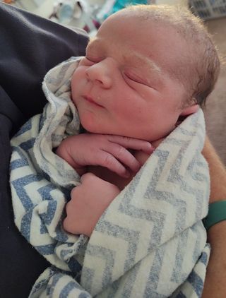 Newborn Baby wrapped in blanket after Hypnobabies Hypnobirthing Home Birth