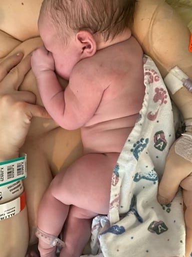 Newborn baby skin to skin and feeding