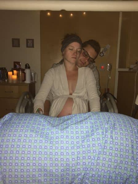 Hypno-mom being supported by partner in hospital during birthing