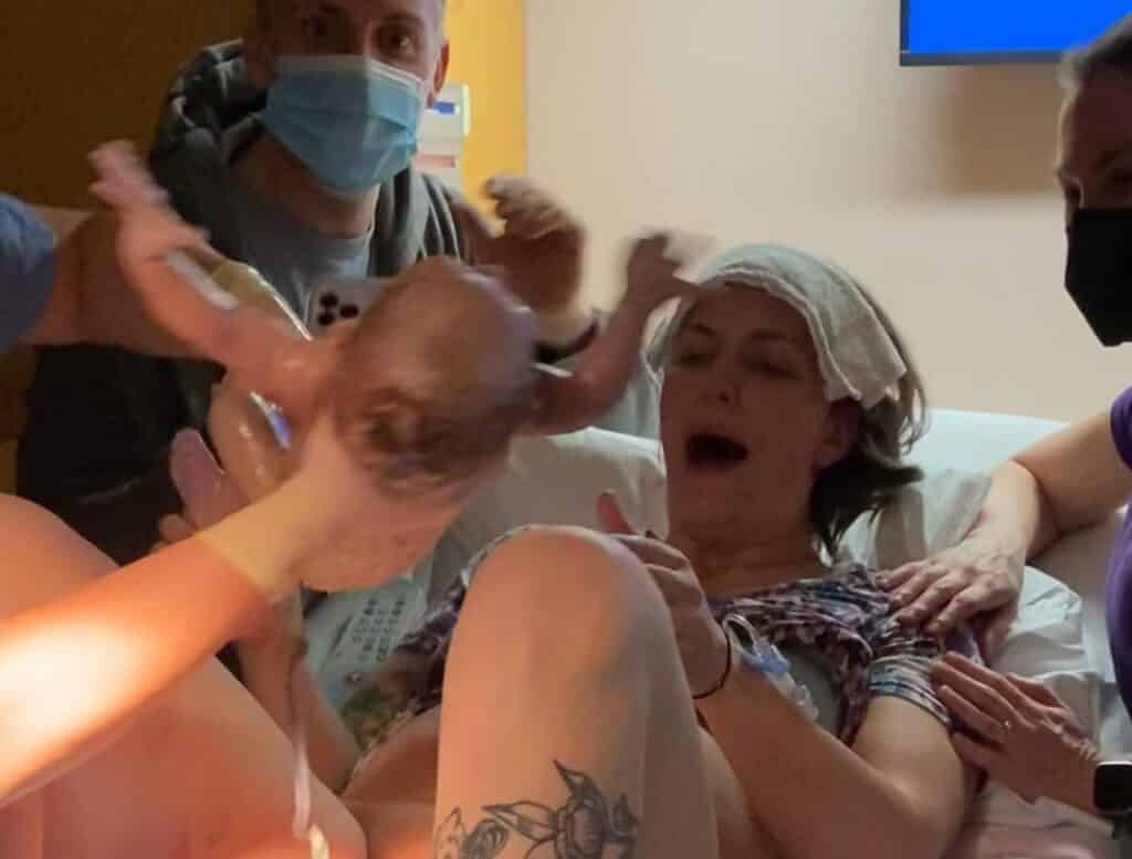 New parent receiving newborn baby