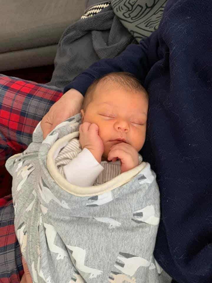 Hypno-mom Monica's baby wrapped in a llama blanket.