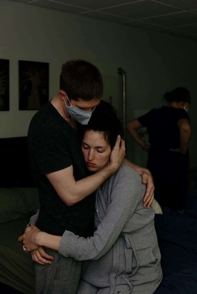 Hugging Birthing Couple