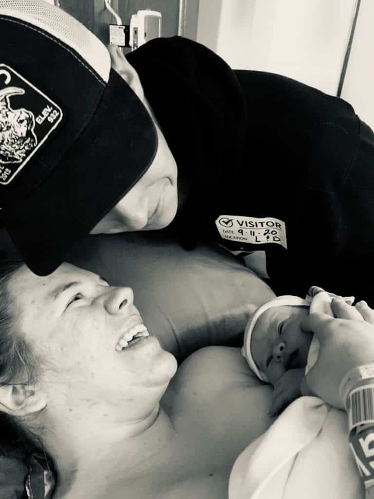 black and white photo of new family right after birth.